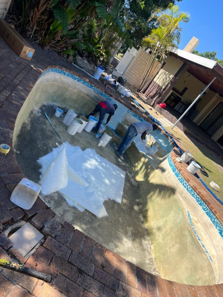 Old pool with a rough, discoloured finish before resurfacing