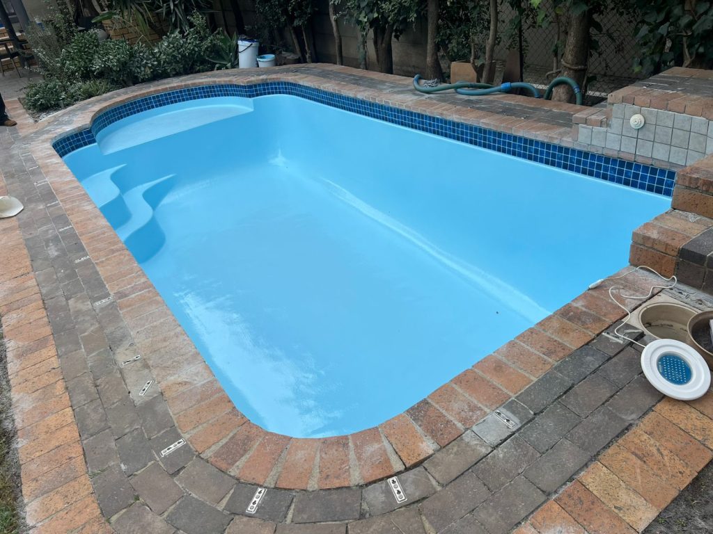 Renovated swimming pool with a fresh blue finish by Aquatic Pools