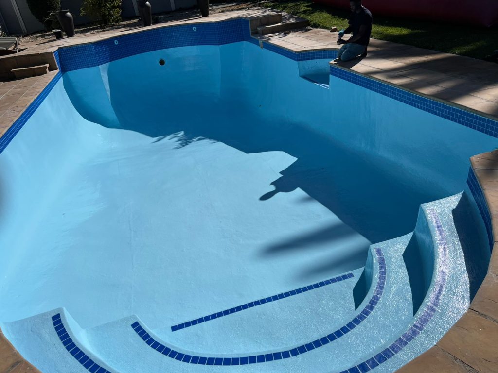 Renovated swimming pool with a fresh blue finish by Aquatic Pools