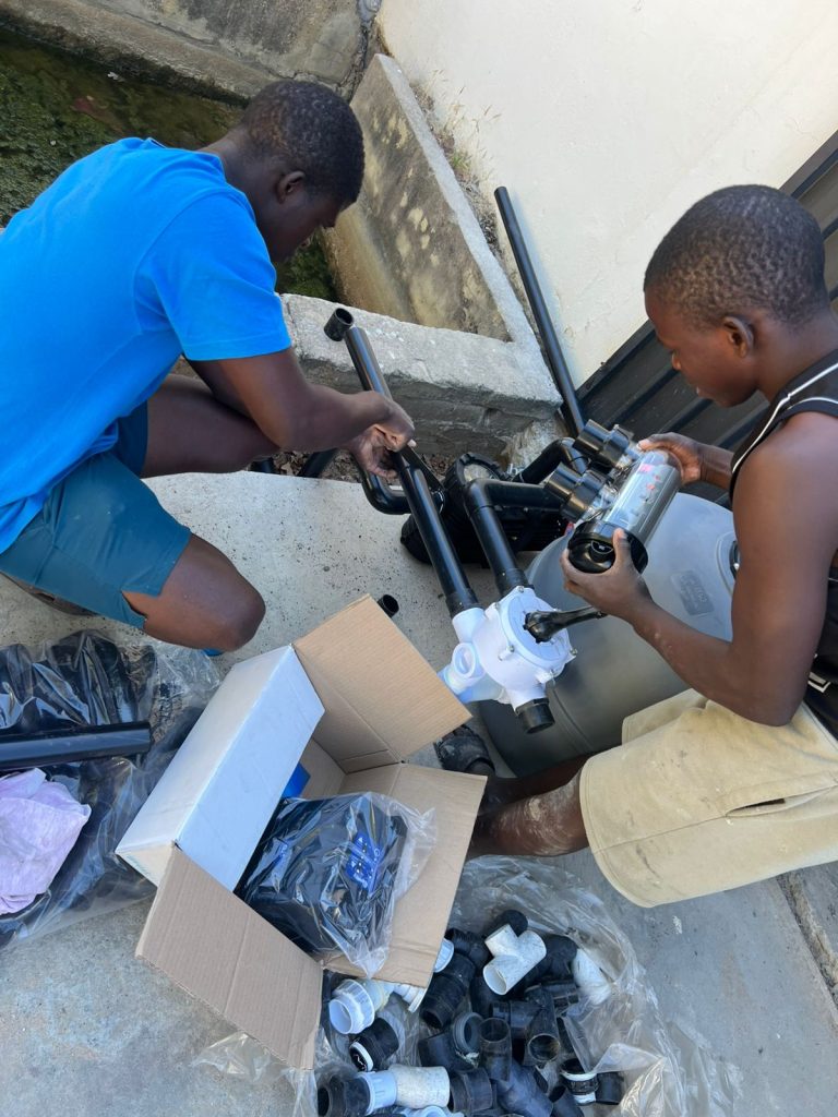 Pool pump and filter being serviced