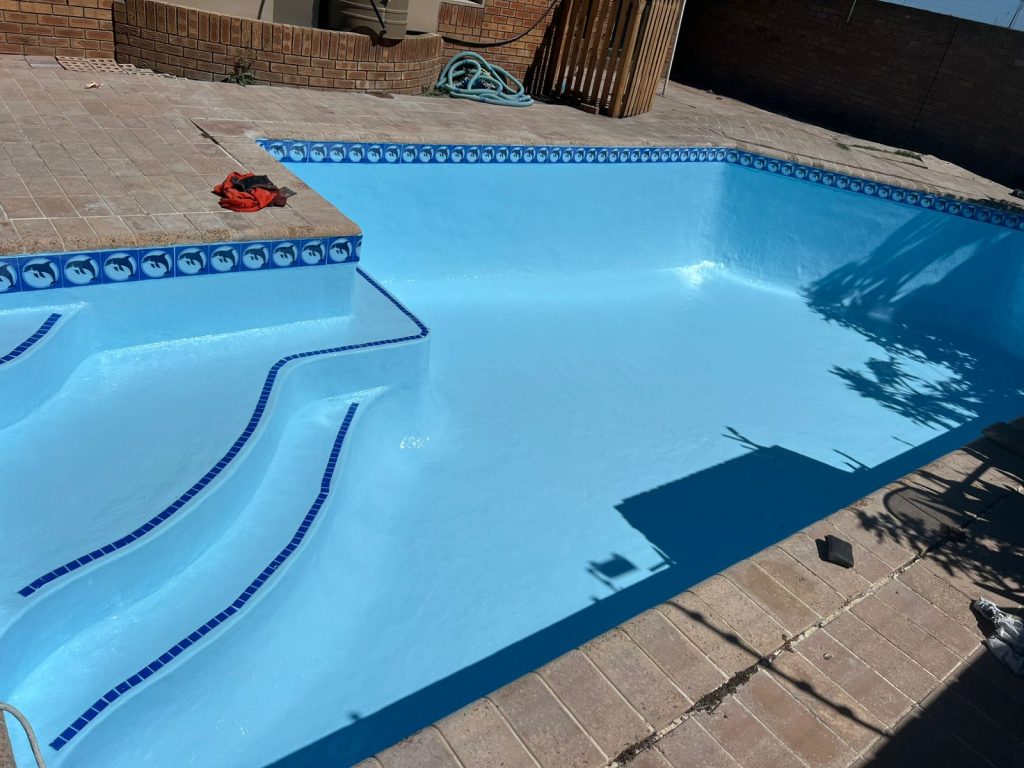 Renovated swimming pool with a fresh blue finish by Aquatic Pools