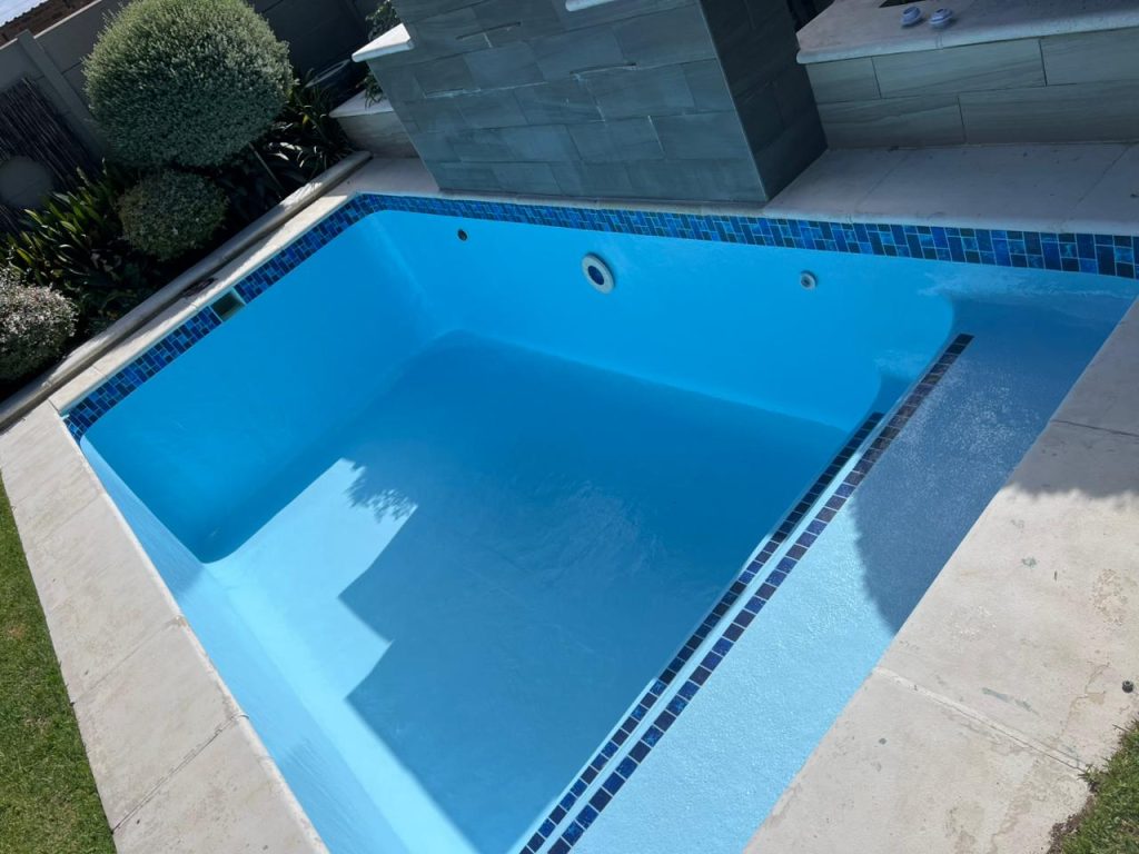 Blue pool interior after resurfacing and relining work