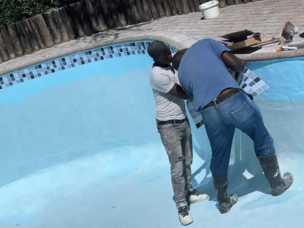 Pool mosaic border and tile work by Aquatic Pools
