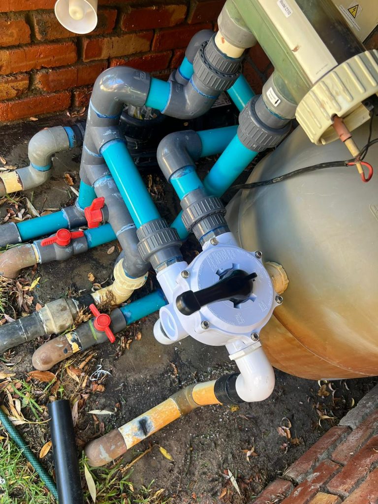 Pool pump and filter being serviced