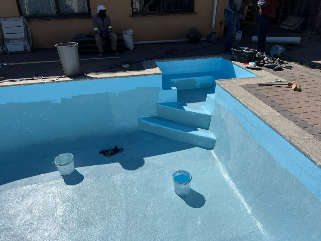 Crack repairs and surface preparation during a pool renovation