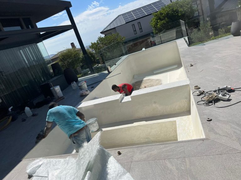 Newly relined swimming pool with steps being finished at a Cape Town home