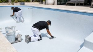 Cleaning and vacuuming a swimming pool to remove stains in Cape Town