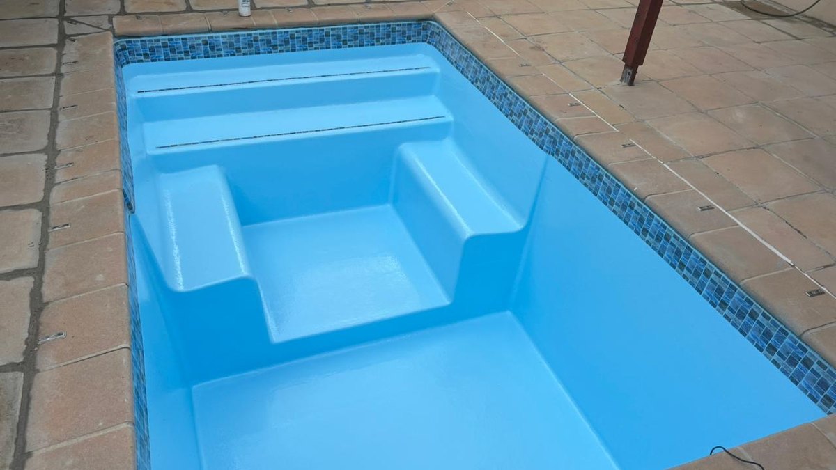 Clear blue swimming pool after green-pool recovery in Cape Town
